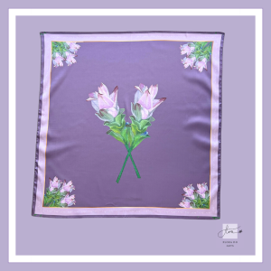 Premium silk scarf featuring two hand-painted Siam tulips crossing at the center, framed by floral corner motifs on a soft lavender background. Designed by Vietnamese artist Flora Do.