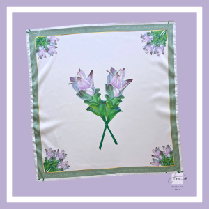 Premium silk scarf featuring two hand-painted Siam tulips crossing at the center, framed by floral corner motifs on a pale lavender background. Designed by Vietnamese artist Flora Do.