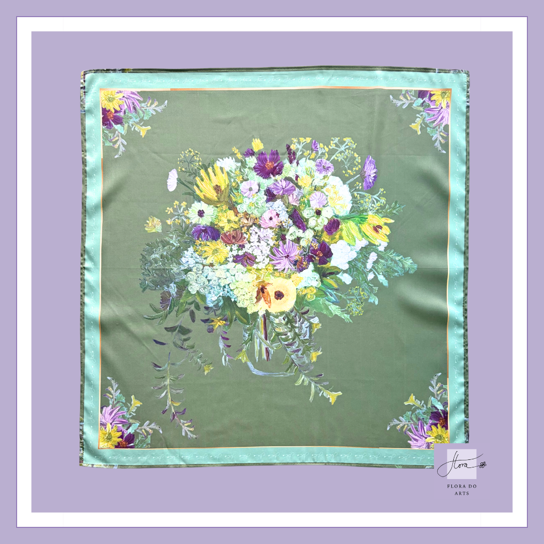 Whispers of Spring silk scarf featuring a colorful bouquet of seasonal flowers in a glass vase against a soft sage green background, with floral corner details inspired by Flora Do's original oil painting.
